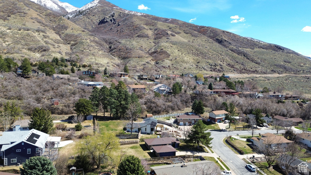Exterior space featuring a residential view and a mountain view
