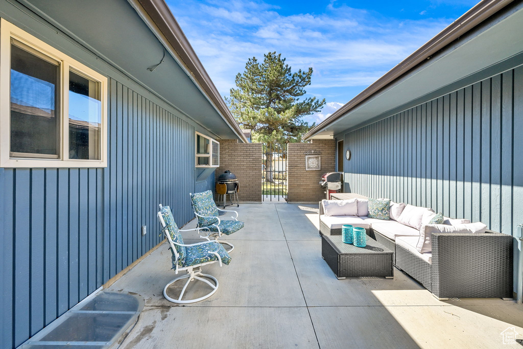 View of patio / terrace with outdoor lounge area and a grill