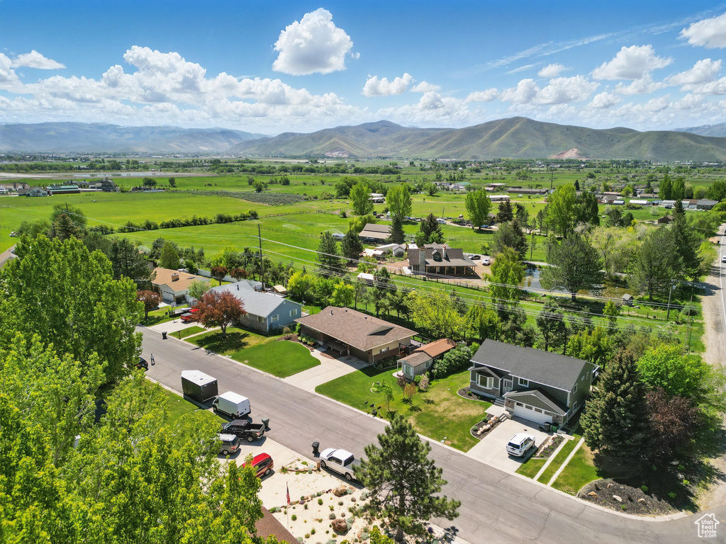 Aerial view of sparsely populated area with a mountainous background