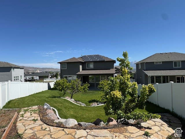 Back of house featuring a fenced backyard