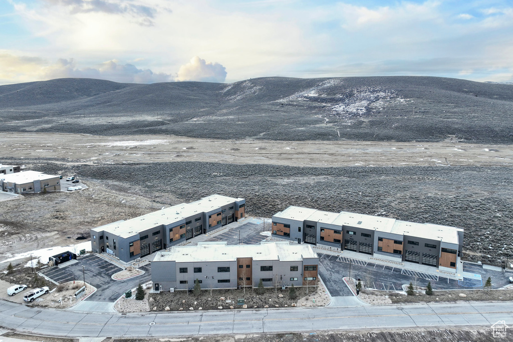 Birds eye view of property with a mountain view