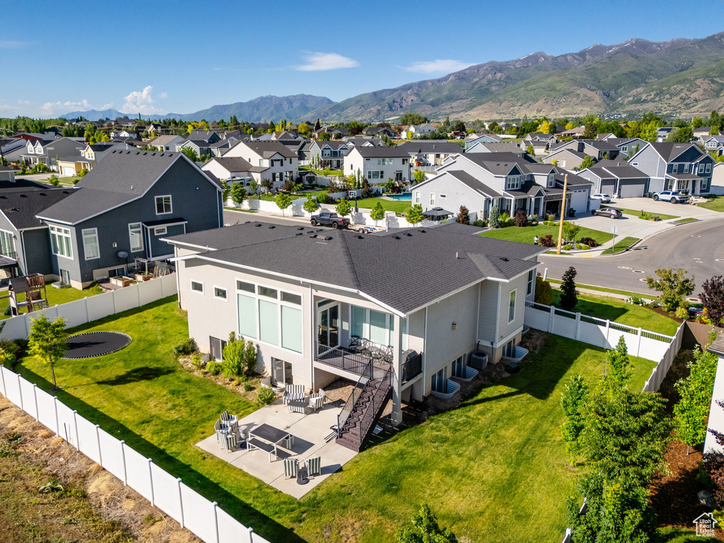 Aerial perspective of suburban area with a mountainous background