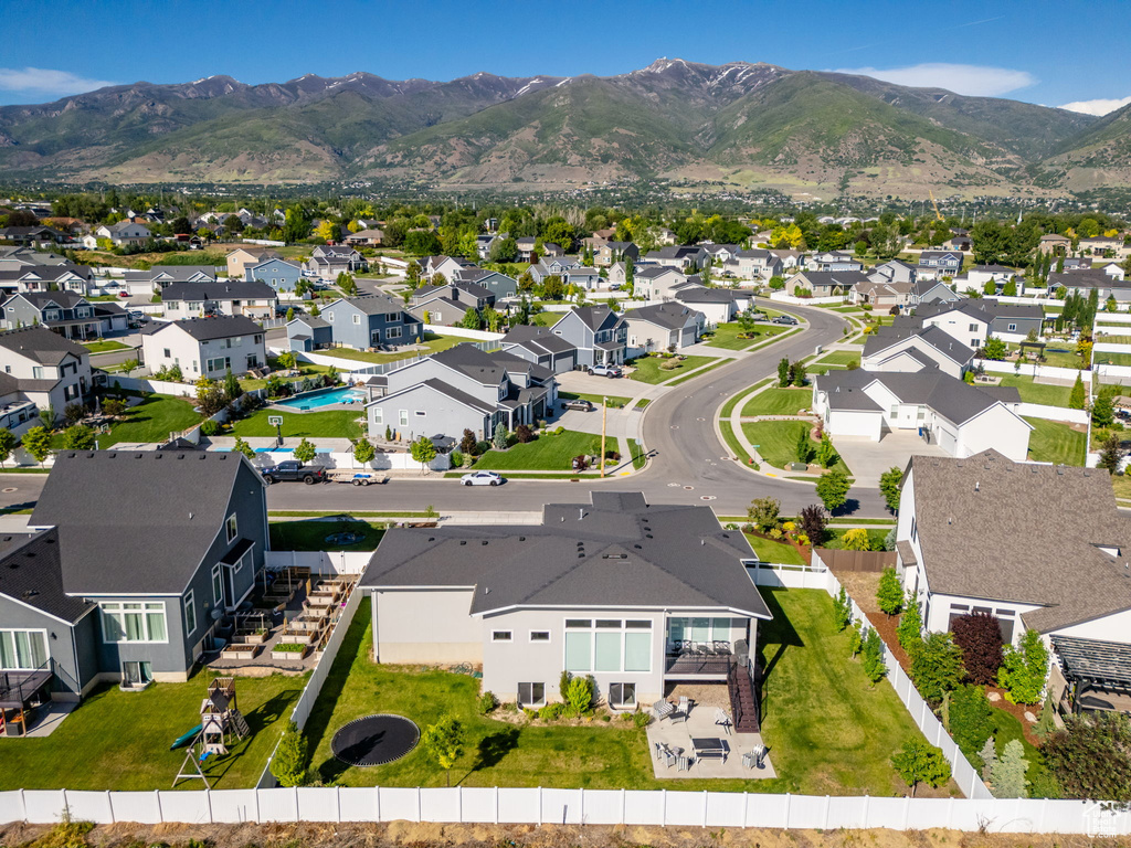 Aerial perspective of suburban area with a mountainous background