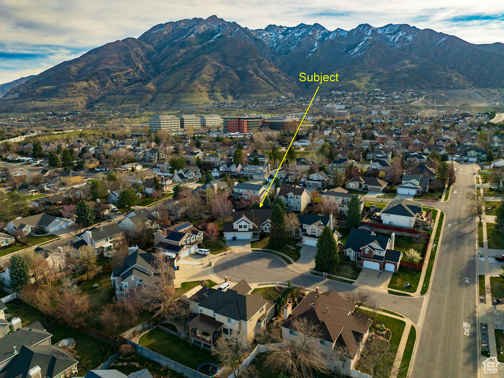 Birds eye view of property with a residential view and a mountain view
