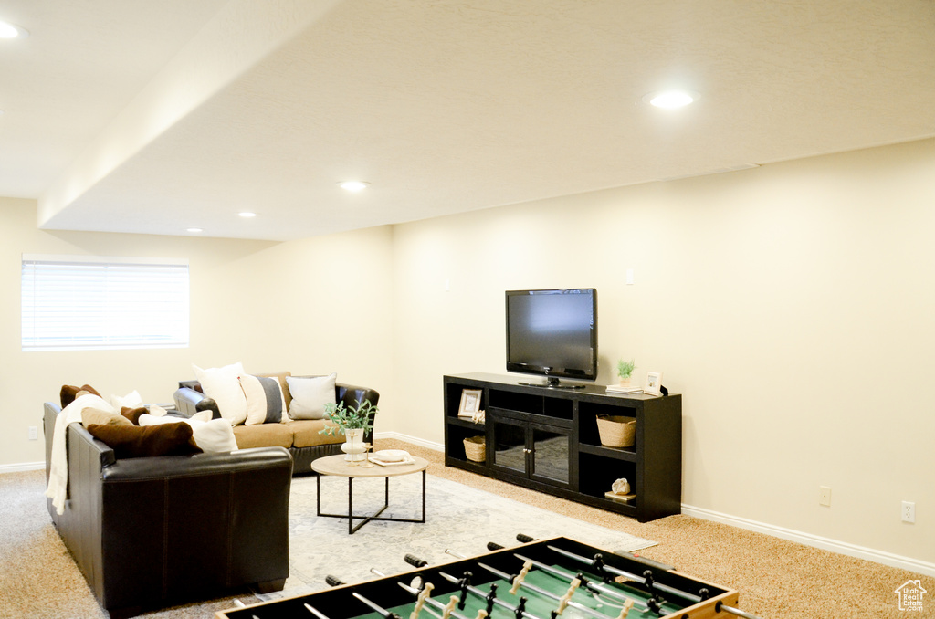 Living room with recessed lighting, carpet flooring, and baseboards