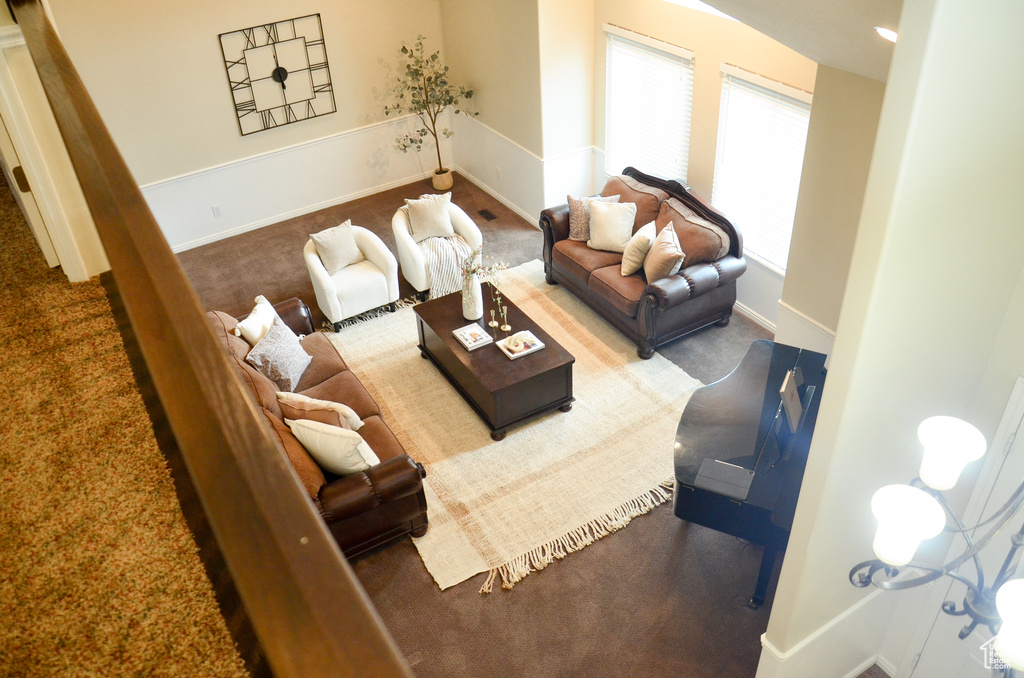 Carpeted living room with baseboards