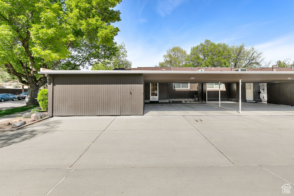 View of front of property with covered parking