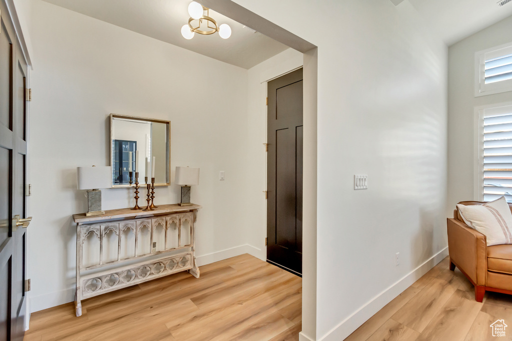 Interior space featuring baseboards and light wood finished floors