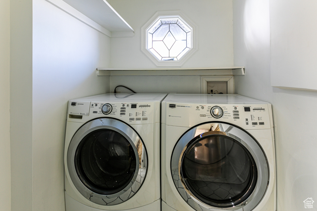 Laundry room featuring washing machine and dryer and laundry area