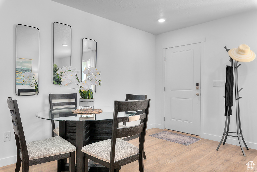 Dining area featuring baseboards and light wood-style flooring