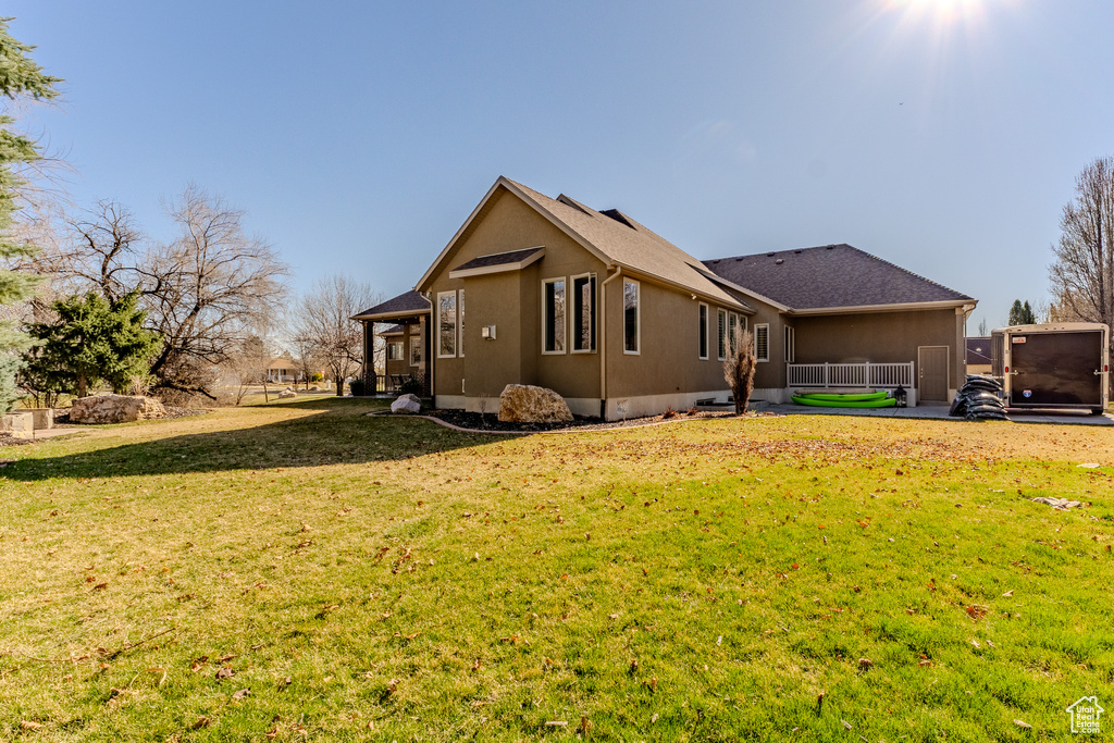 View of home's exterior with a yard