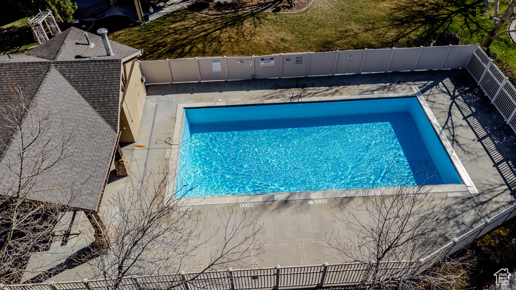 View of swimming pool featuring fence and a fenced in pool