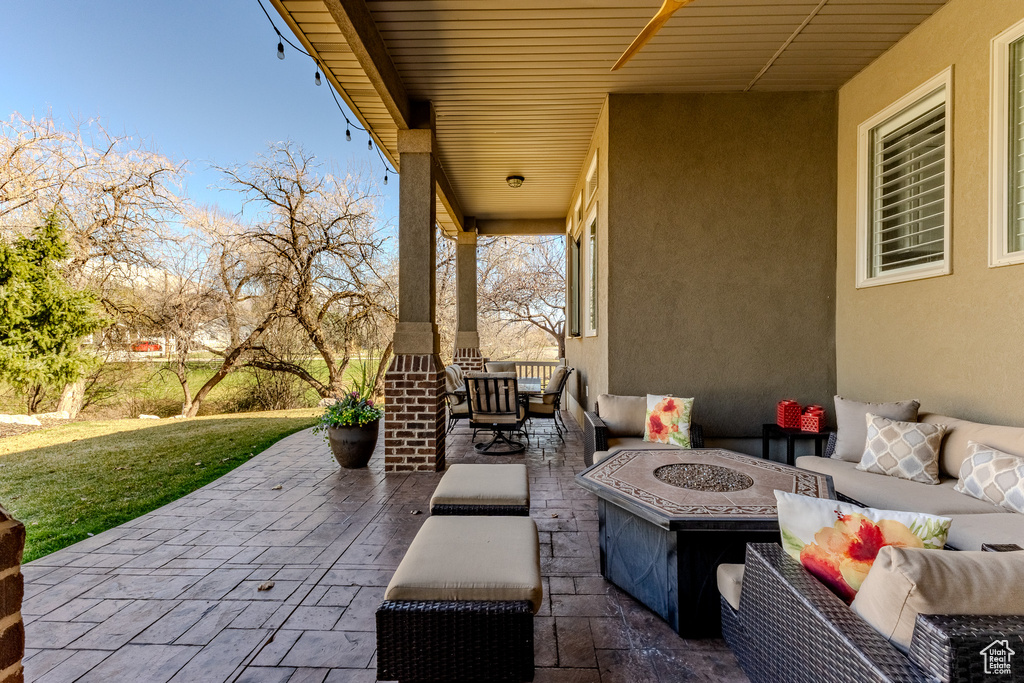 View of patio / terrace with an outdoor living space with a fire pit