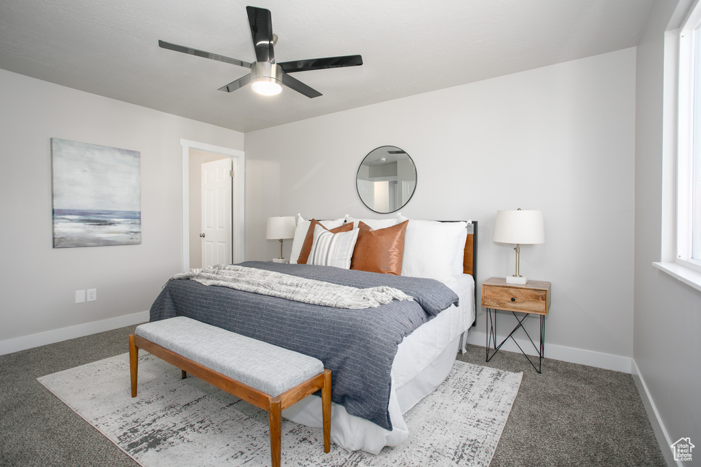 Bedroom featuring carpet flooring, a ceiling fan, and baseboards
