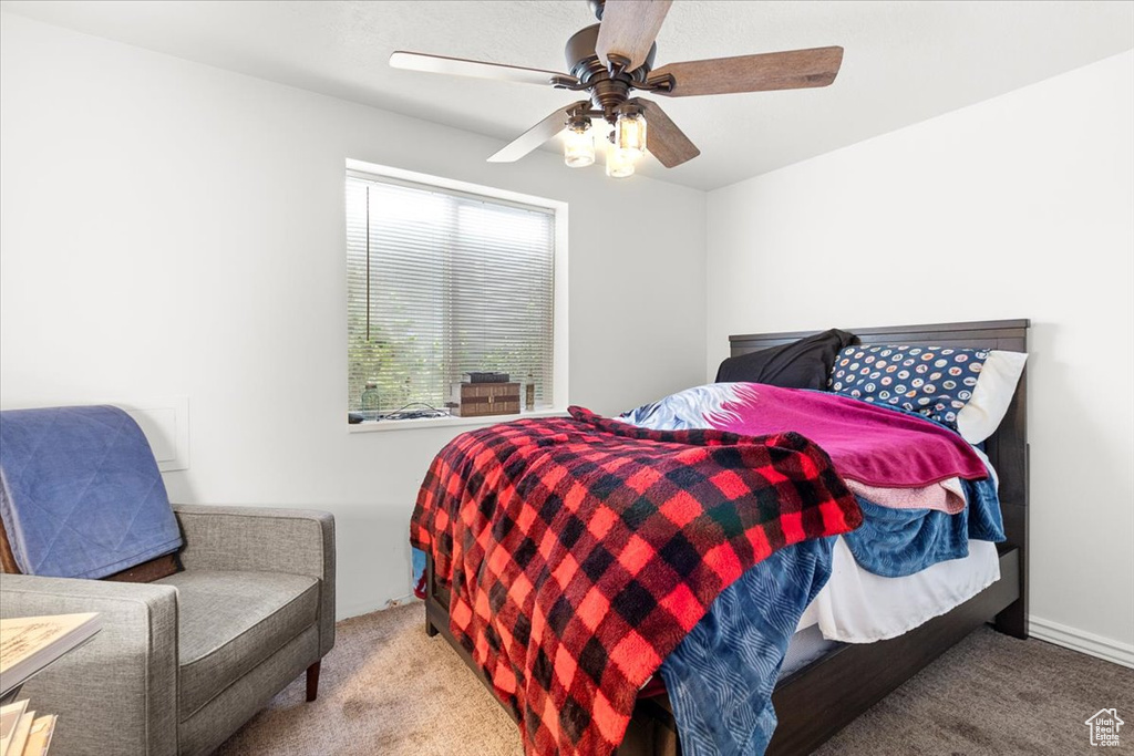Bedroom with carpet flooring and a ceiling fan