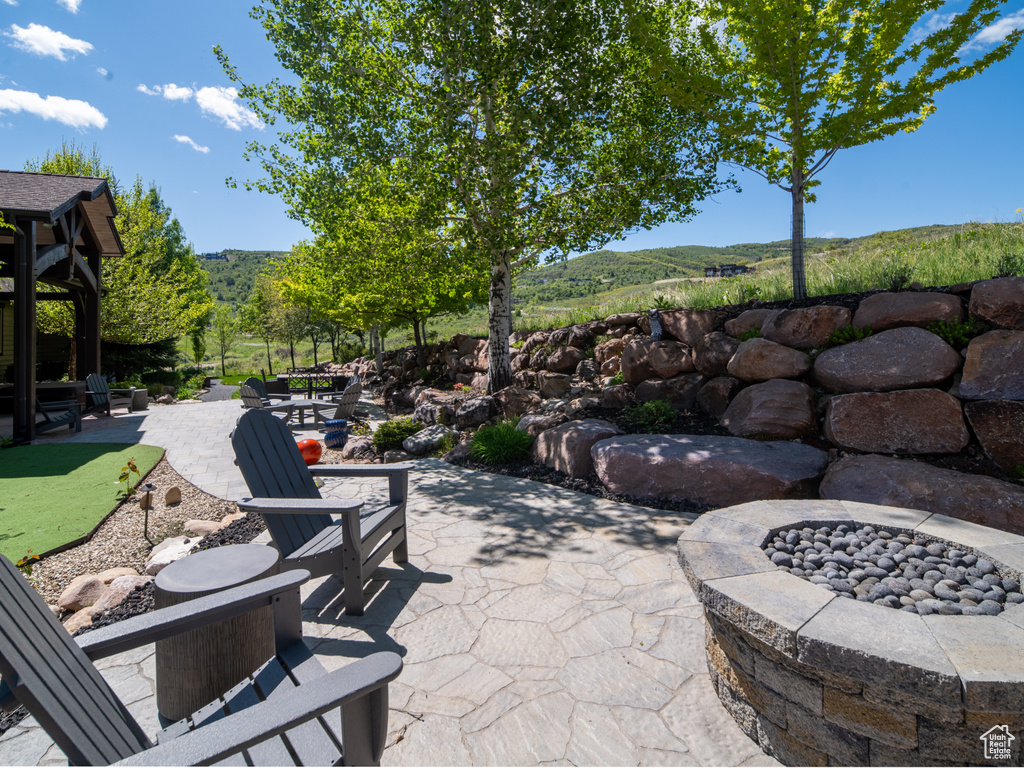 View of patio / terrace with an outdoor fire pit