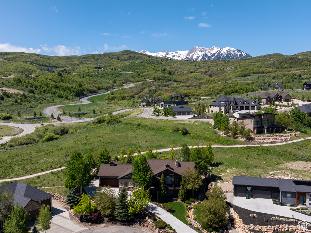 Aerial perspective of suburban area featuring a mountainous background