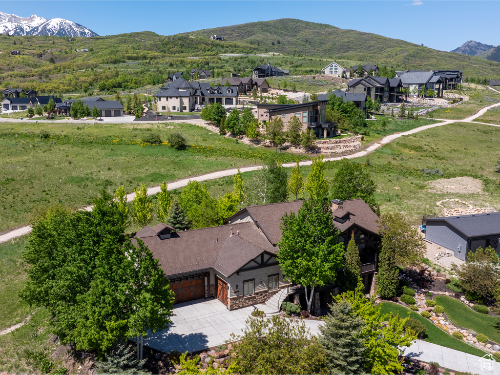 Aerial perspective of suburban area with a mountainous background