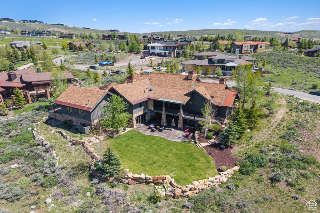Aerial view of property's location with nearby suburban area