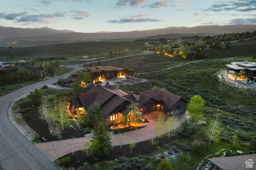 View from above of property with a mountain backdrop