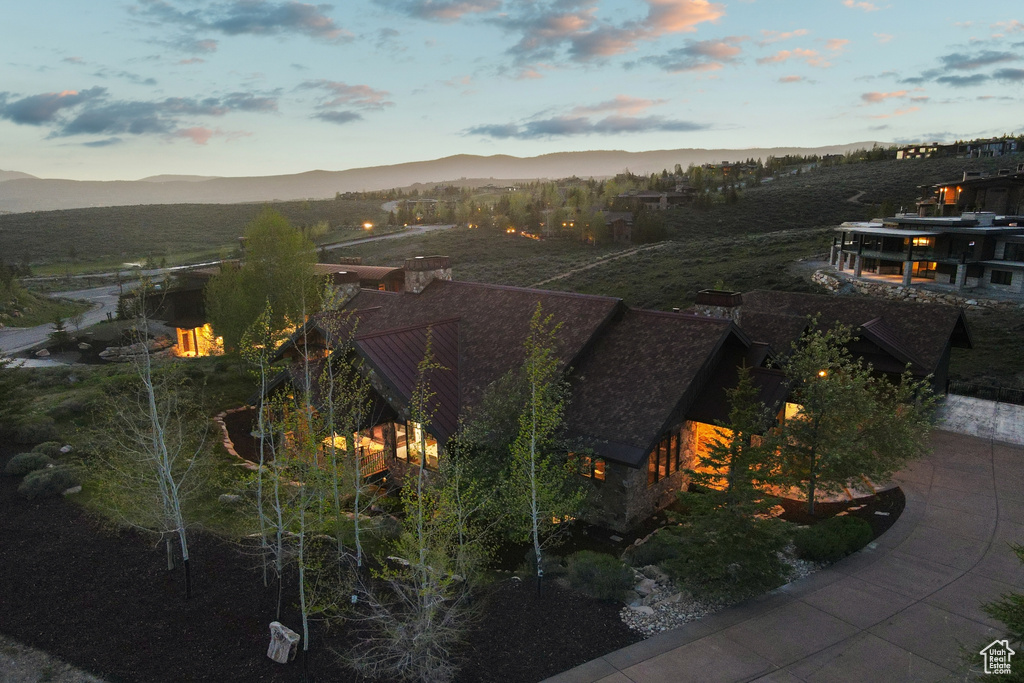 Aerial view of property and surrounding area with mountains