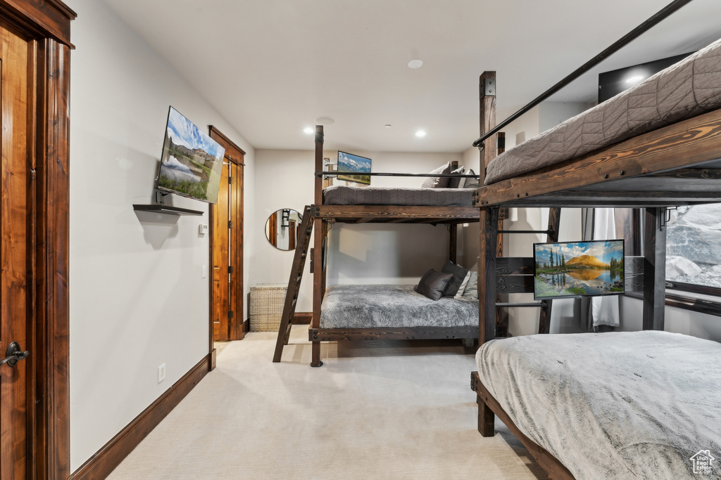 Carpeted bedroom featuring recessed lighting and baseboards
