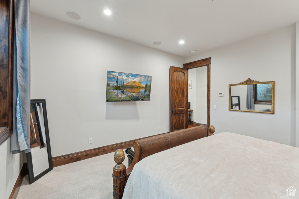 Bedroom featuring recessed lighting, light colored carpet, and baseboards