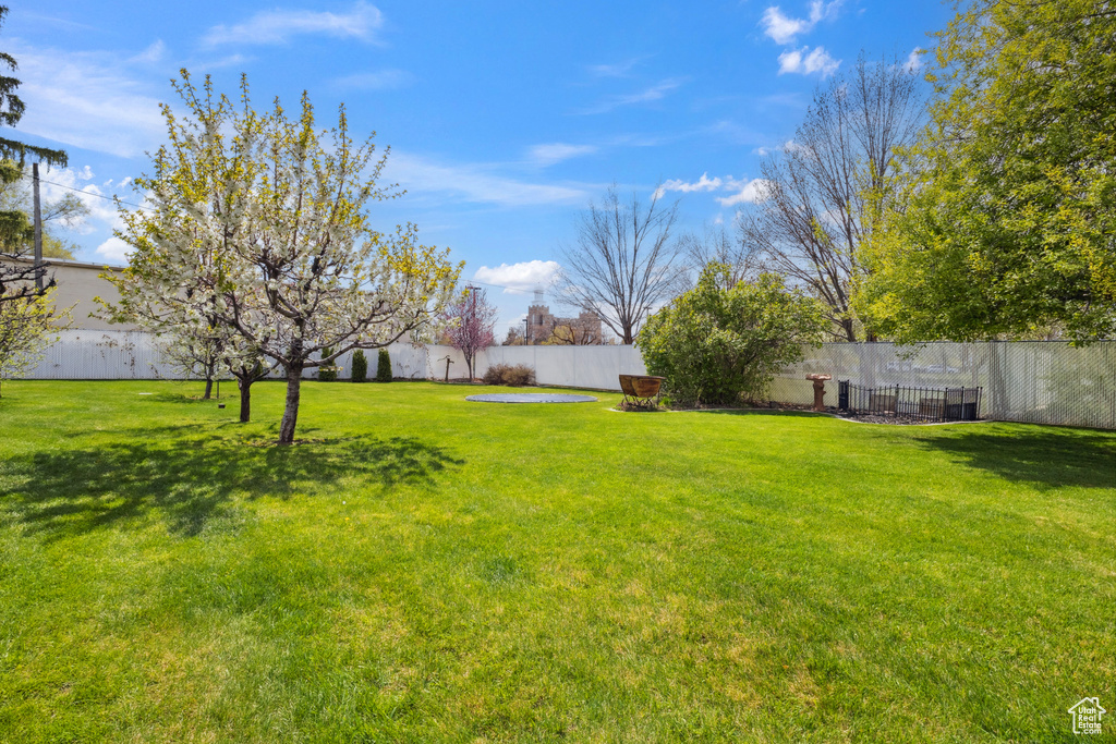 View of yard featuring fence