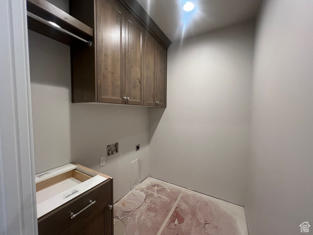 Laundry area with cabinet space and electric dryer hookup