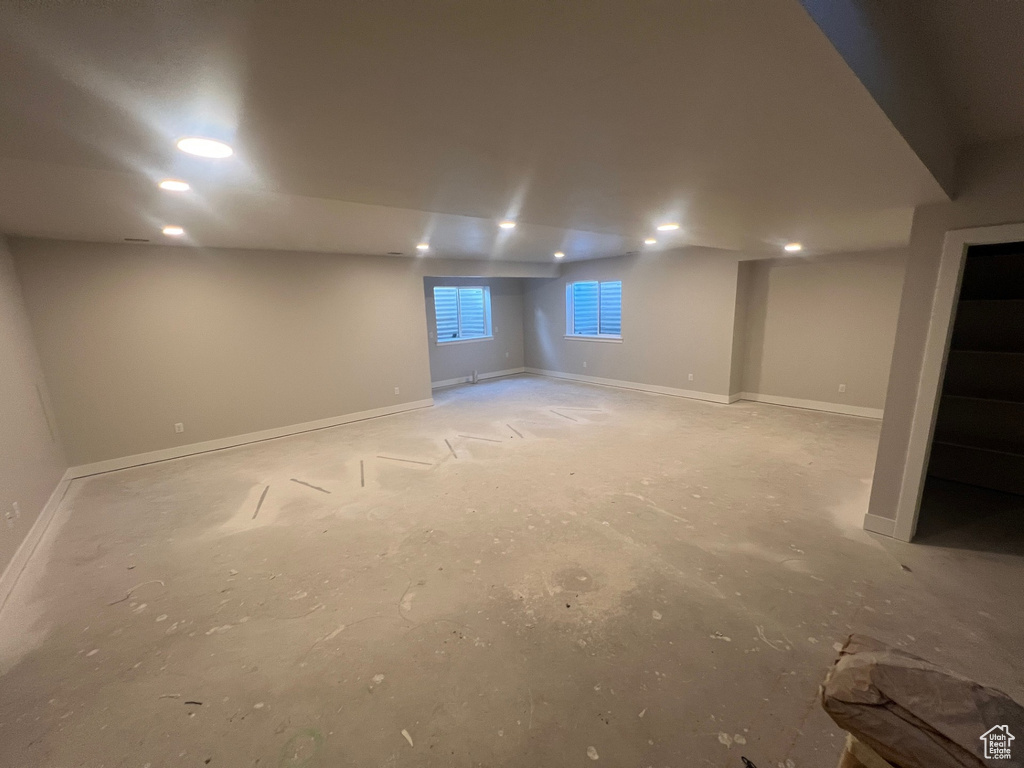 Basement featuring recessed lighting and baseboards