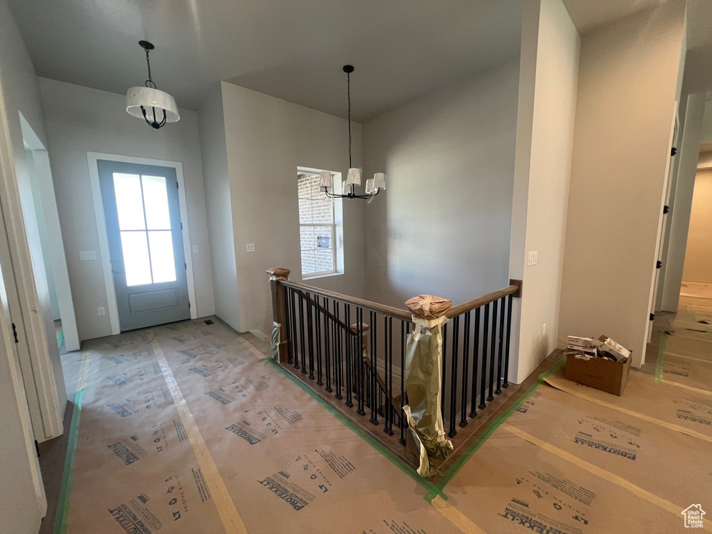 Entrance foyer featuring a notable chandelier