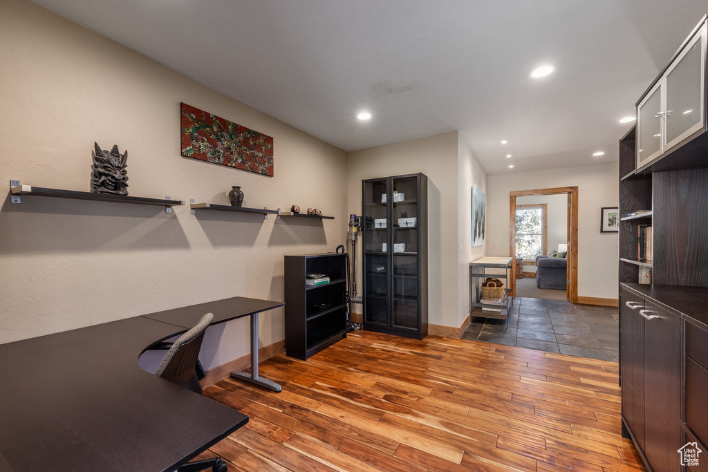 Office space with recessed lighting, baseboards, and hardwood / wood-style floors