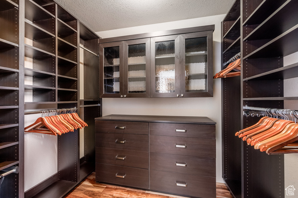 Spacious closet featuring light wood-style floors