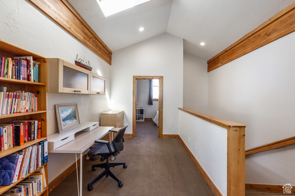Carpeted office featuring recessed lighting, baseboards, and lofted ceiling with skylight