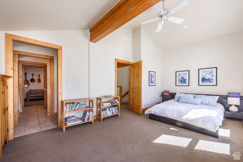 Carpeted bedroom featuring high vaulted ceiling, beamed ceiling, and a ceiling fan