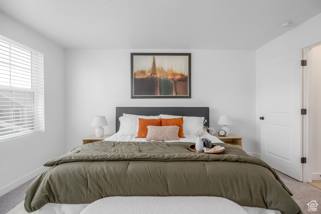 Carpeted bedroom with baseboards
