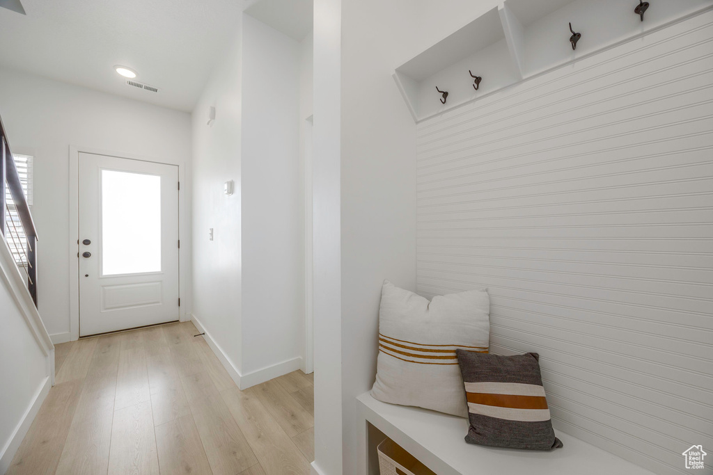 Mudroom with recessed lighting, visible vents, baseboards, and light wood-type flooring