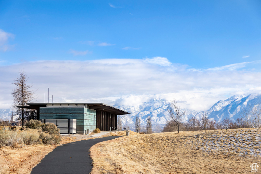 View of pole building with a mountain view