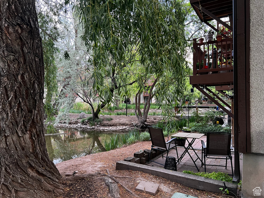 View of yard featuring stairs and a patio area