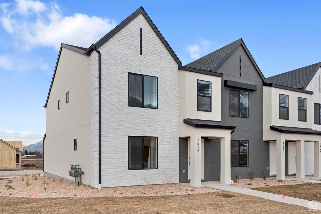 View of front of property with brick siding