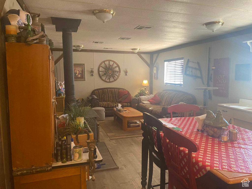 Dining area with visible vents and light wood-type flooring