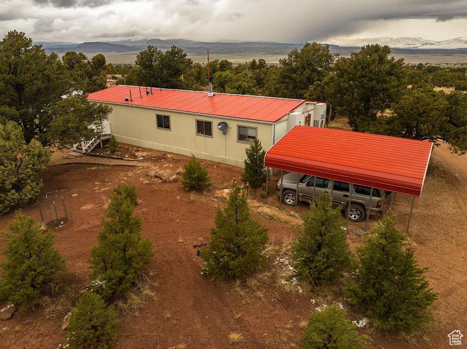 Birds eye view of property with a mountain view