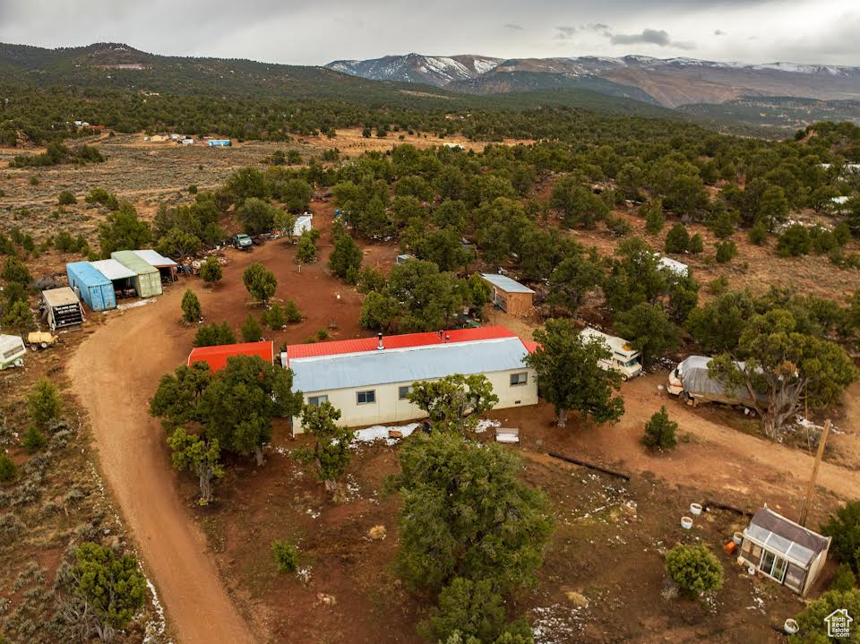 Birds eye view of property with a mountain view
