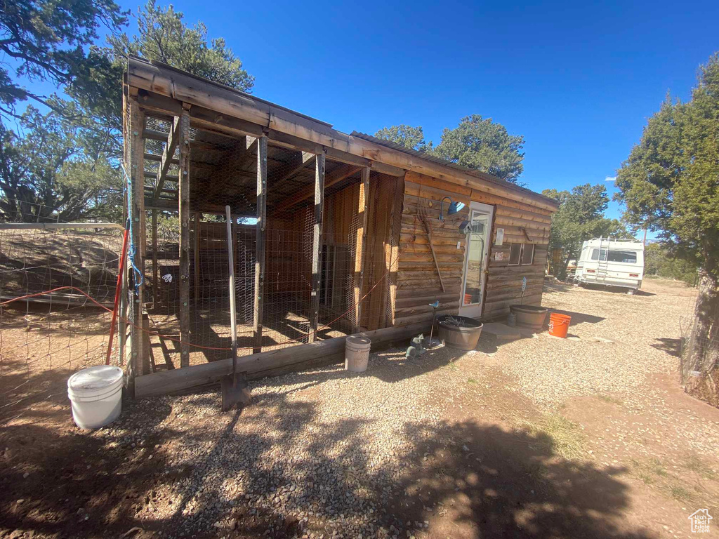 Rear view of house featuring an outdoor structure