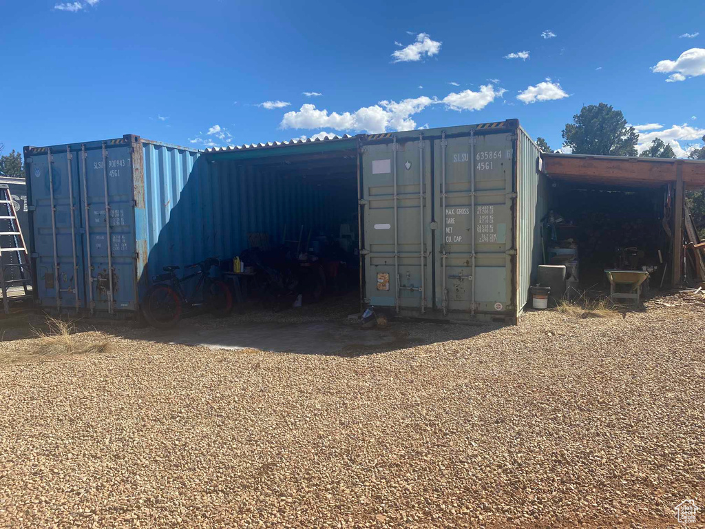 View of outbuilding with a carport