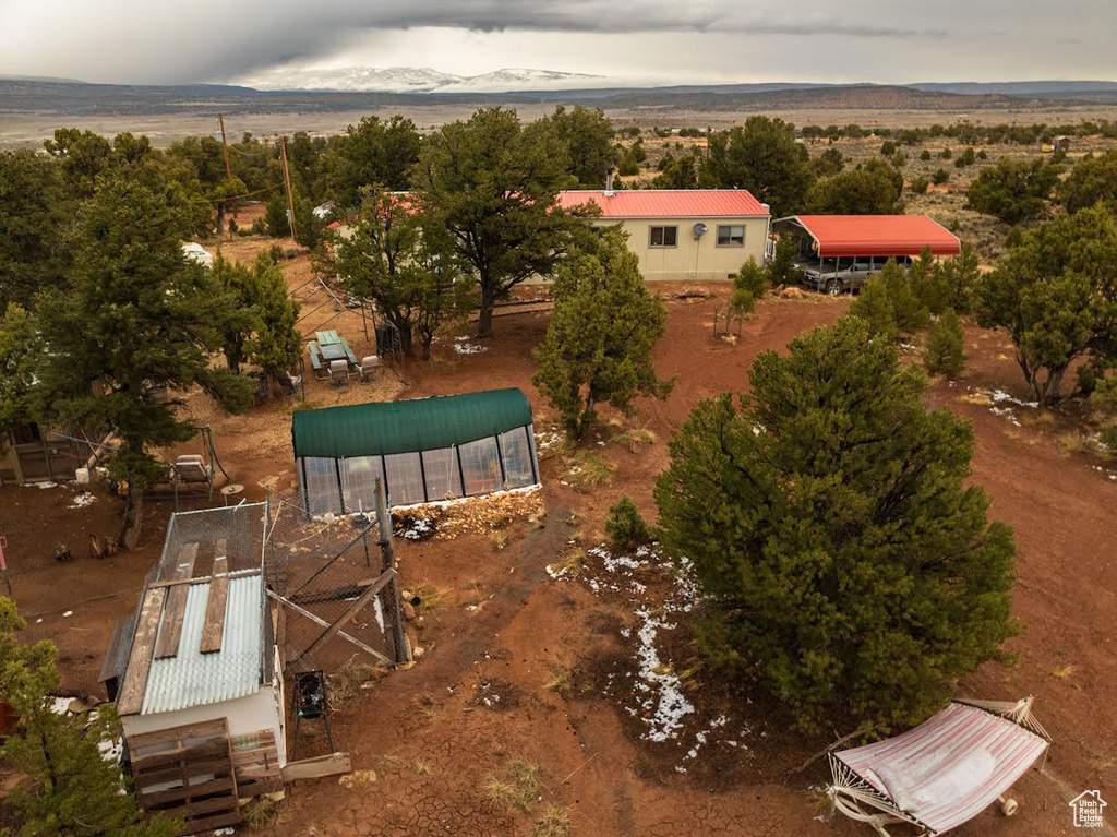 Birds eye view of property with a mountain view
