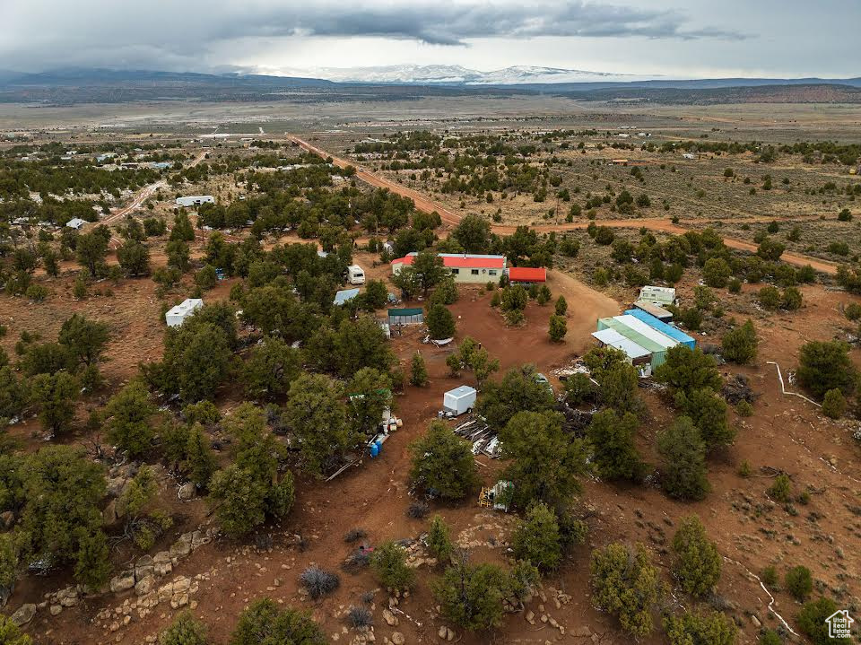 Birds eye view of property featuring a mountain view and a rural view
