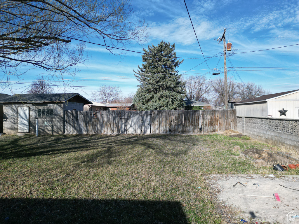 View of yard featuring fence