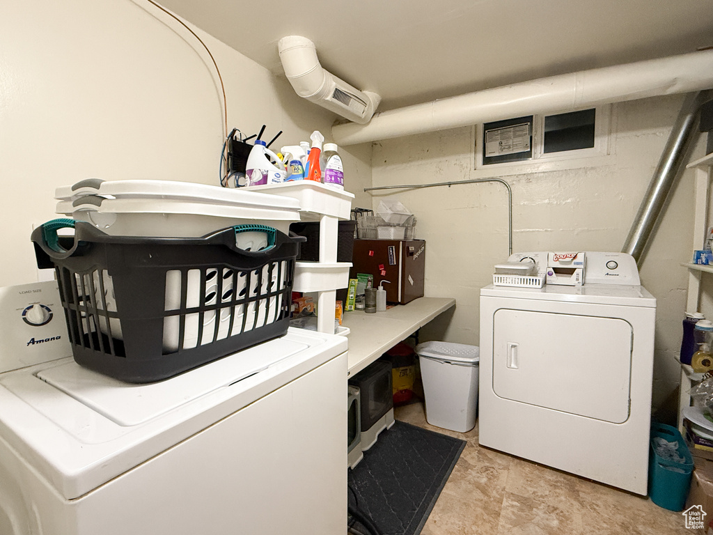 Washroom with separate washer and dryer and laundry area