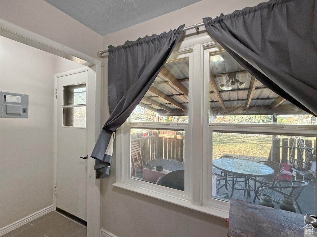 Doorway to outside with baseboards